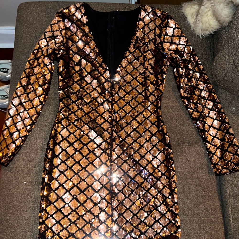 Rose Gold and Black sequin mini dress. Long sleeve v neck.